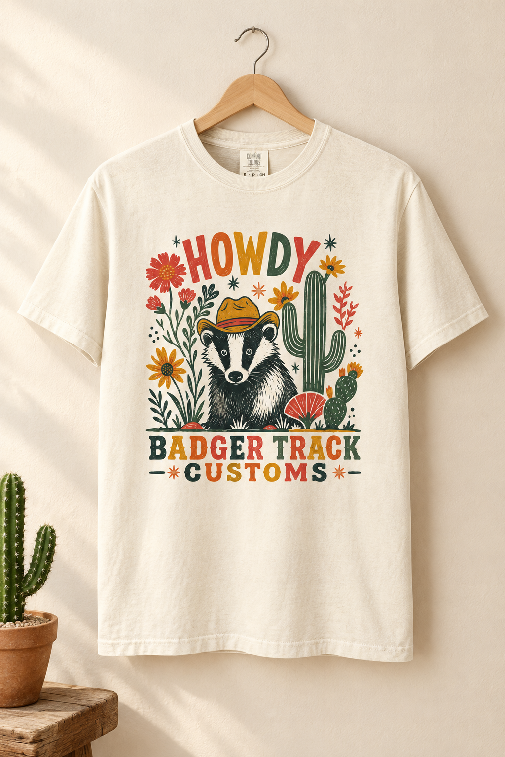 Howdy badger tee styled on a hanger