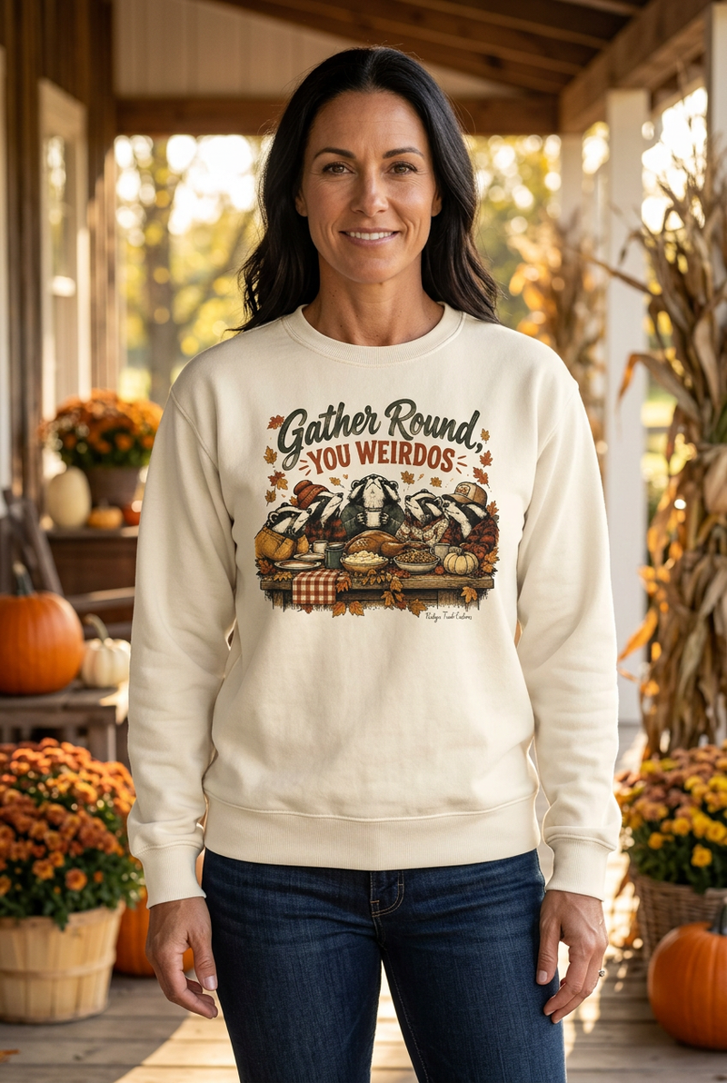 Woman wearing the Gather Round crewneck on an autumn farmhouse porch