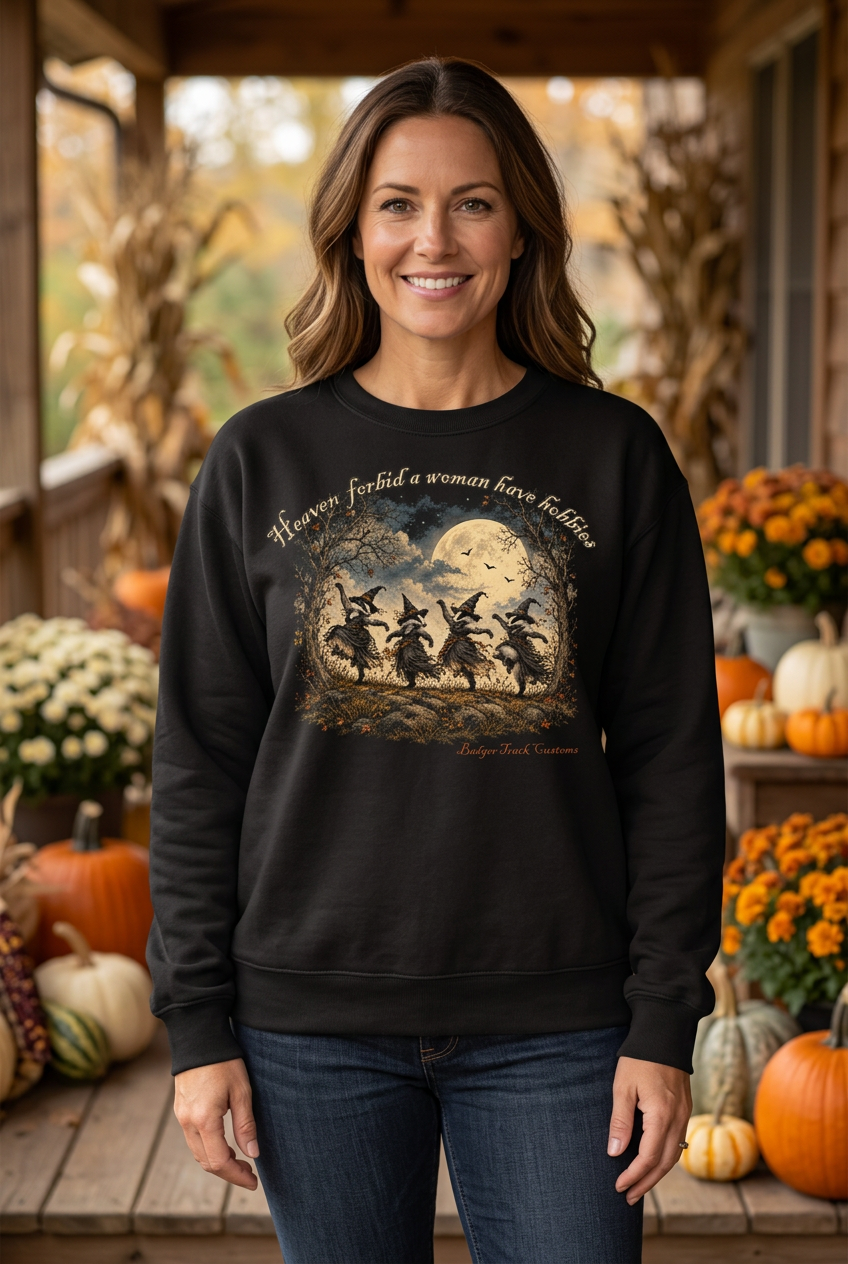 Woman wearing the witch badger crewneck on a fall porch